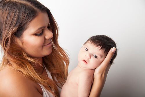 Mother holding newborn baby